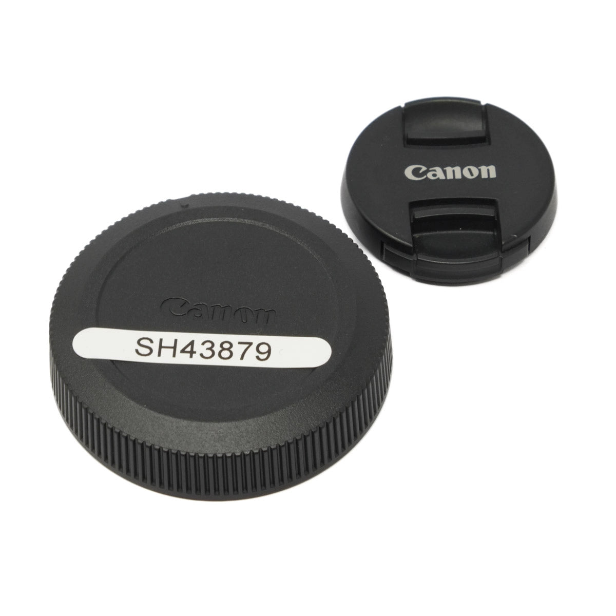 Canon camera lens cap and body cap on a white background