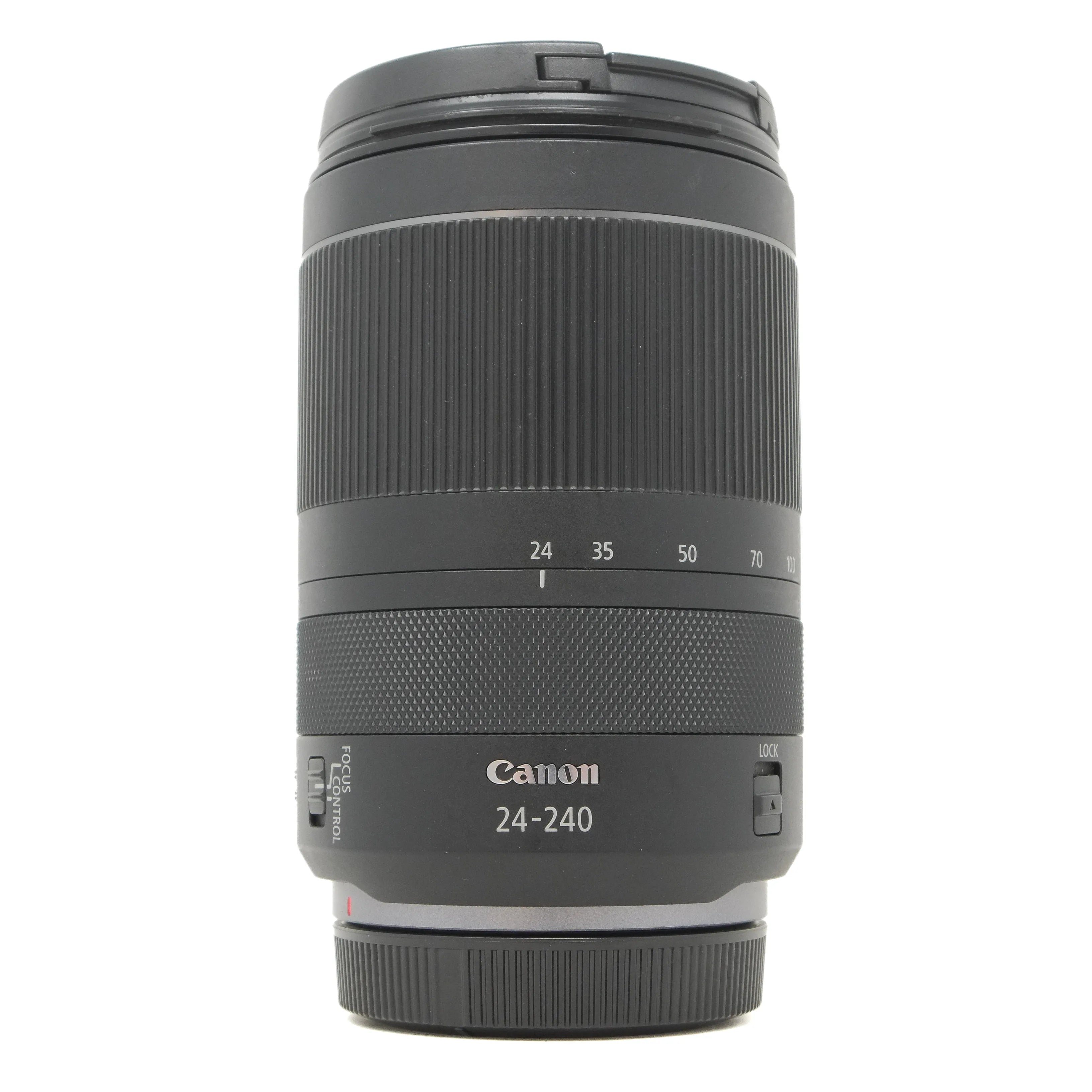 Canon camera lens with focus scale on a white background