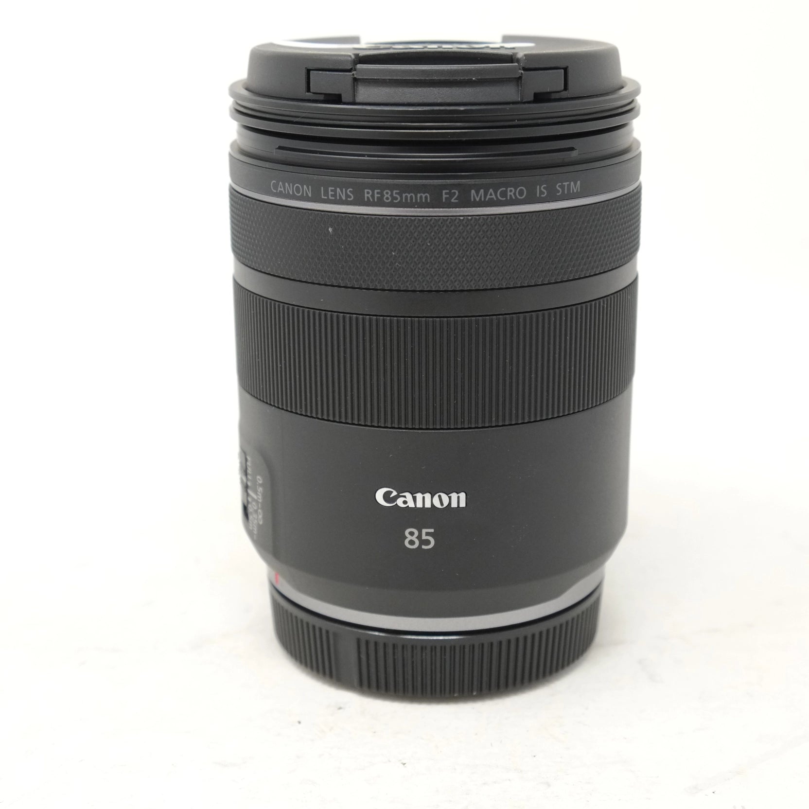 Canon camera lens with 'Canon' branding on a white background