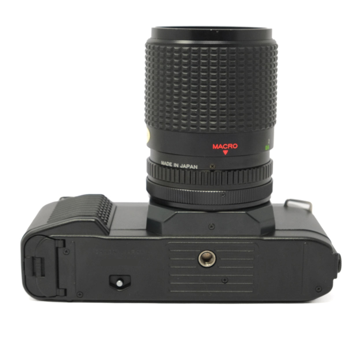 Camera lens with 'Made in Japan' text on a white background