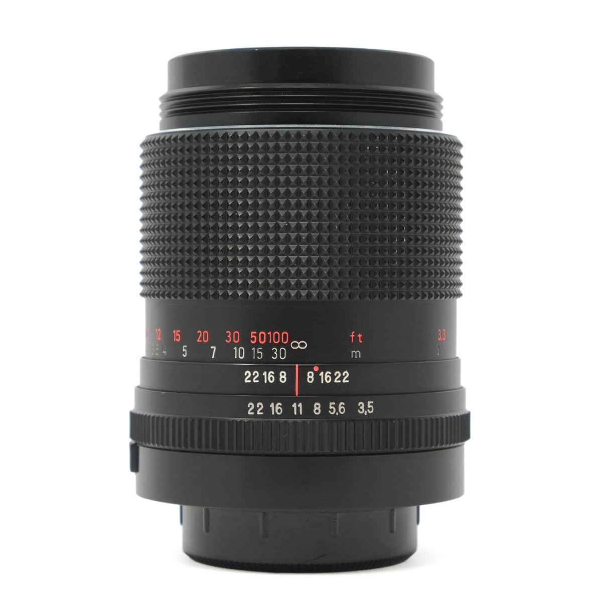 Black camera lens with focus scale on a white background