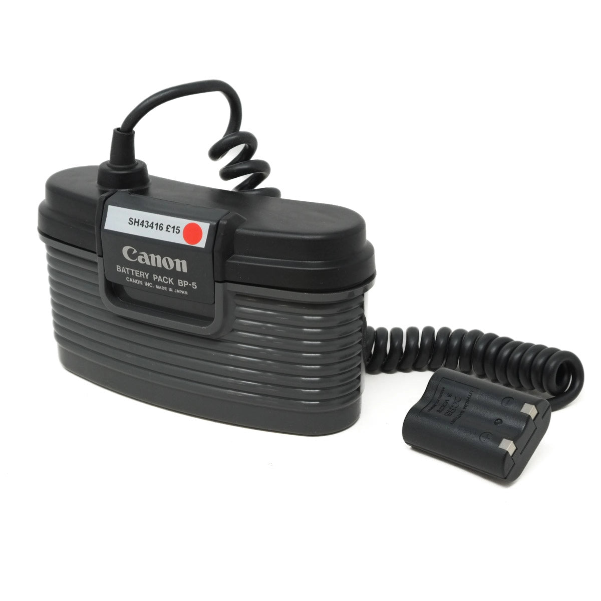 Canon battery pack with coiled cable on a white background