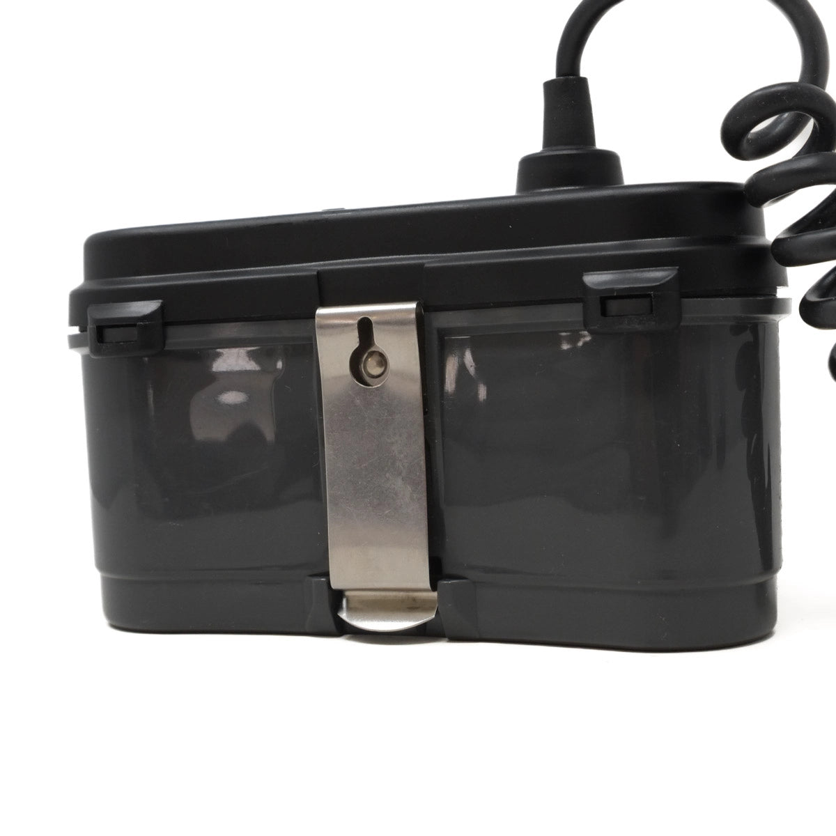 Black electronic device with a metallic clip on a white background