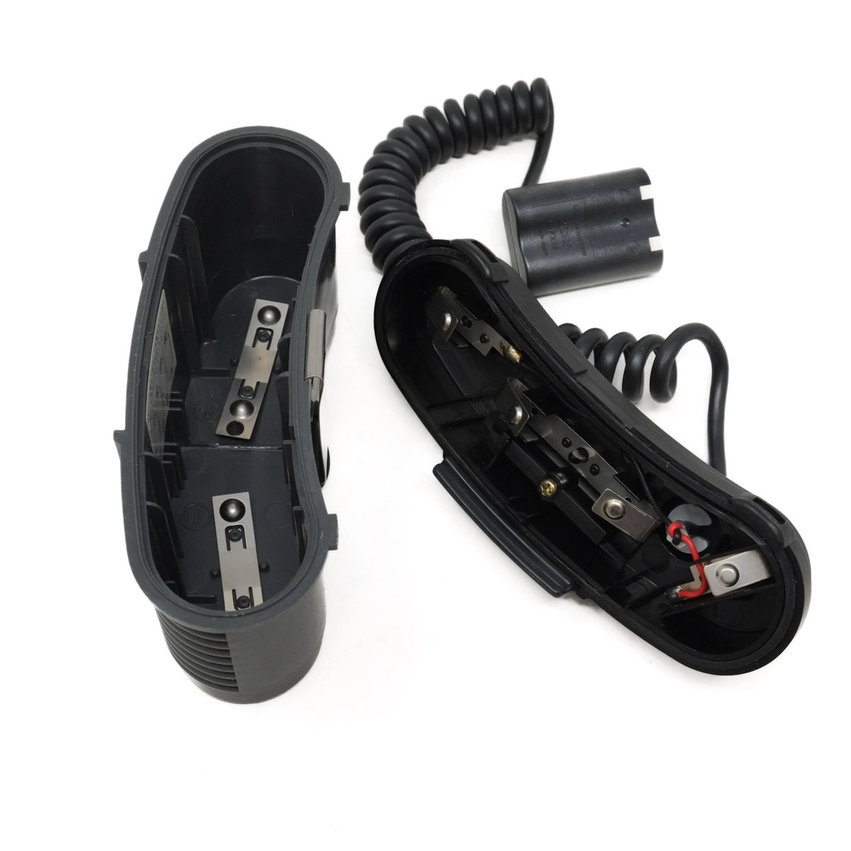 Canon battery pack open with a coiled cord on a white background