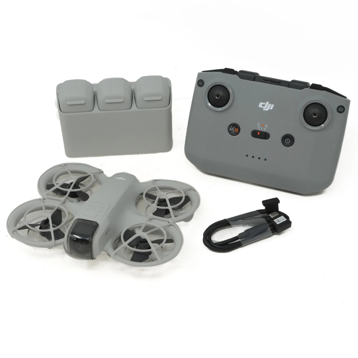 Gray drone and controller set on a white background