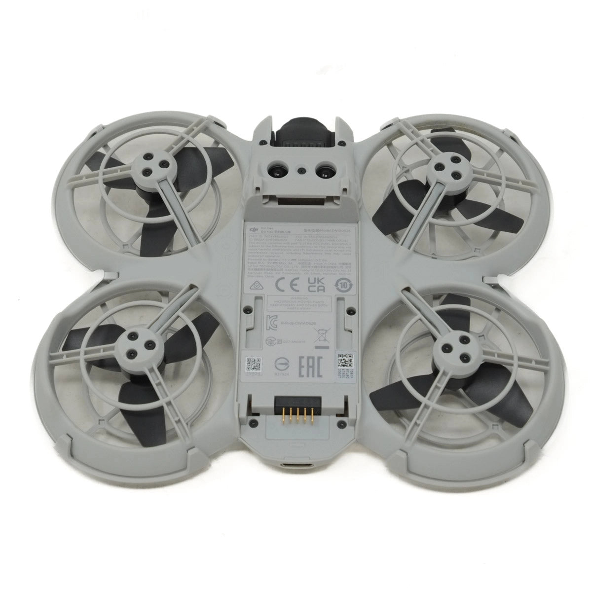 Gray drone with four propellers on a white background