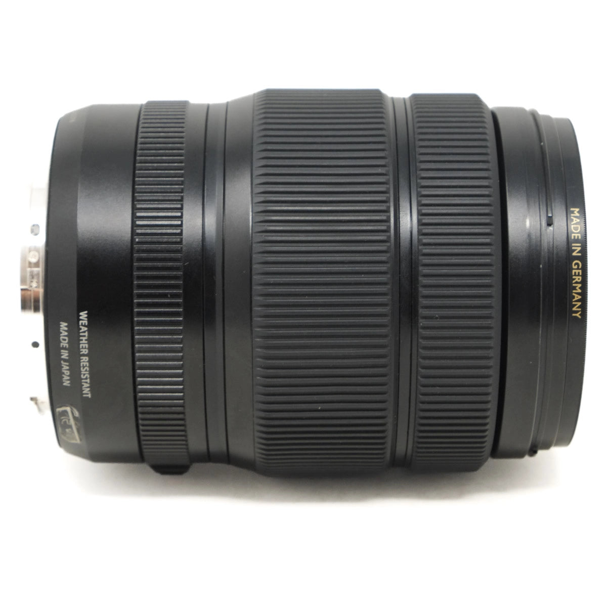 Camera lens with 'Made in Germany' text on a white background