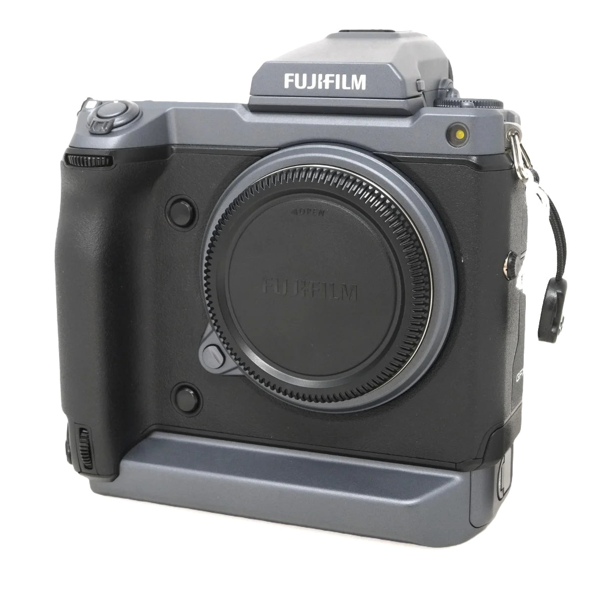 A Fujifilm medium format mirrorless camera body with a gray and black grip, shown from the front on a white background.