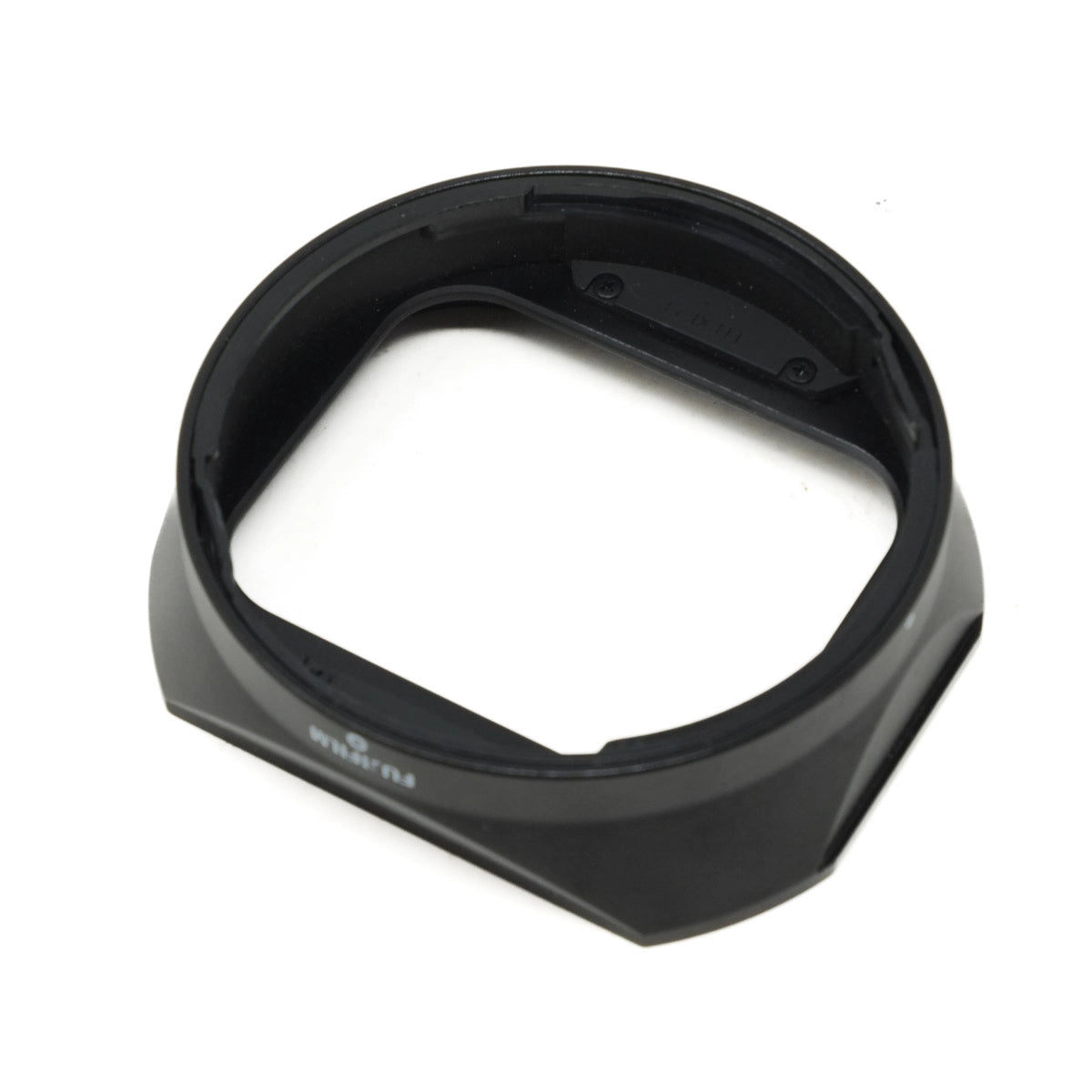 Black camera lens hood on a white background