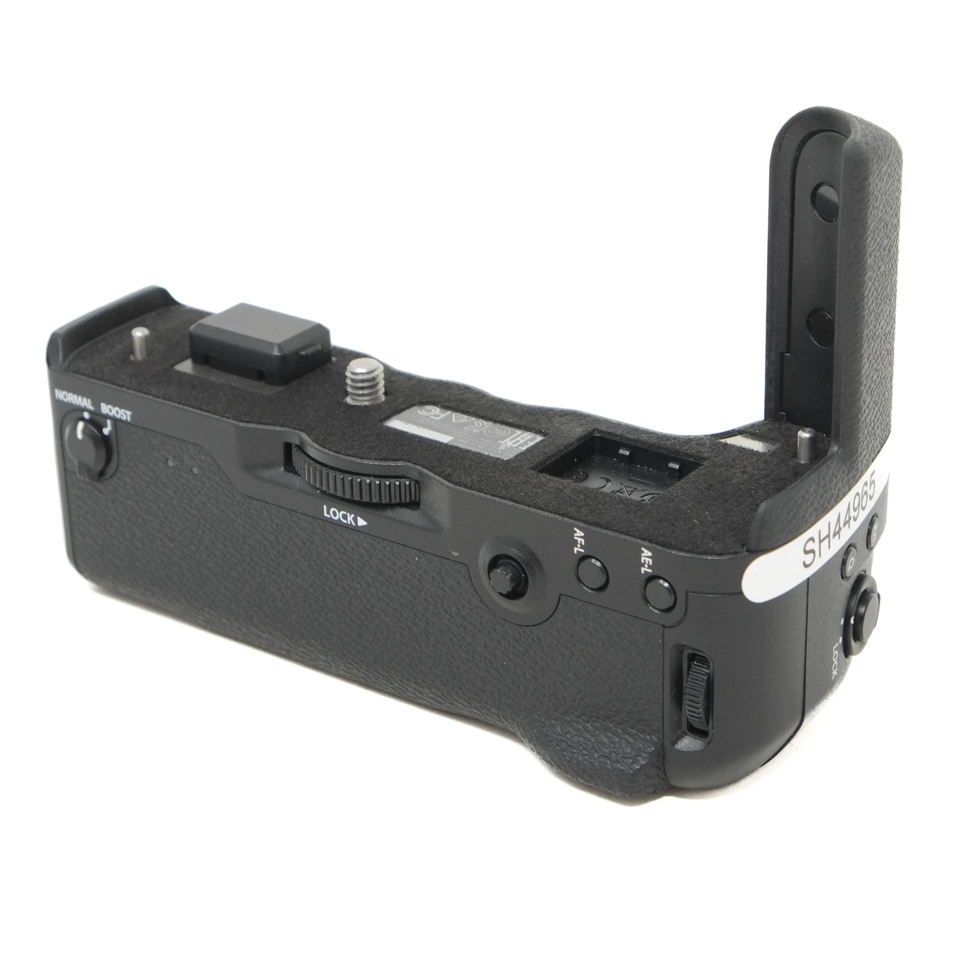 Black camera battery grip on a white background