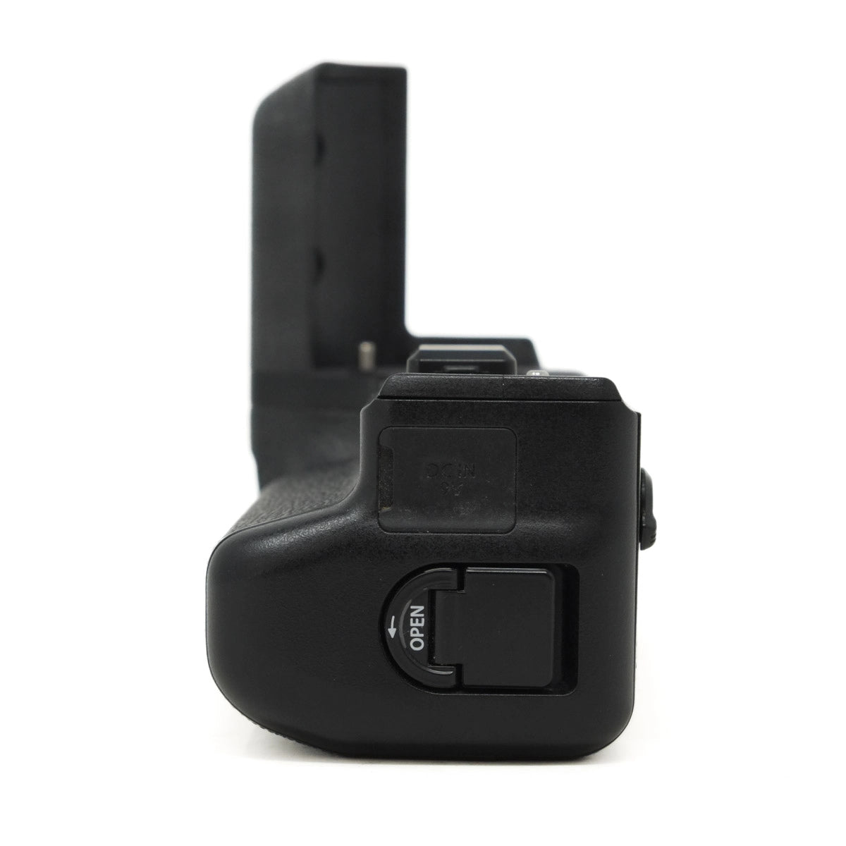 Black camera battery grip on a white background
