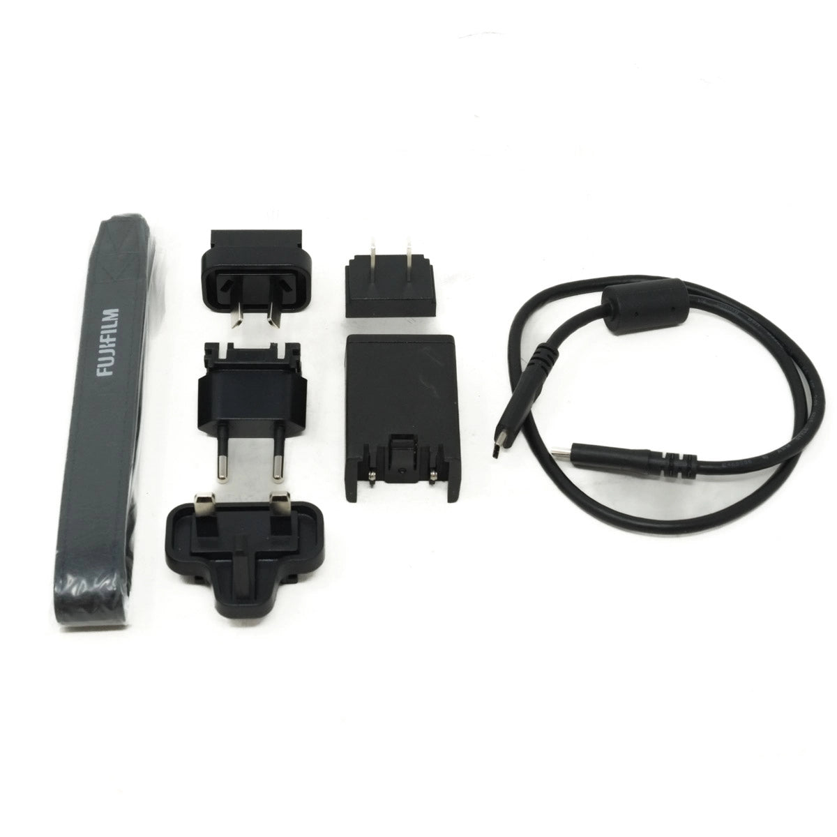Set of Fujifilm camera accessories on a white background