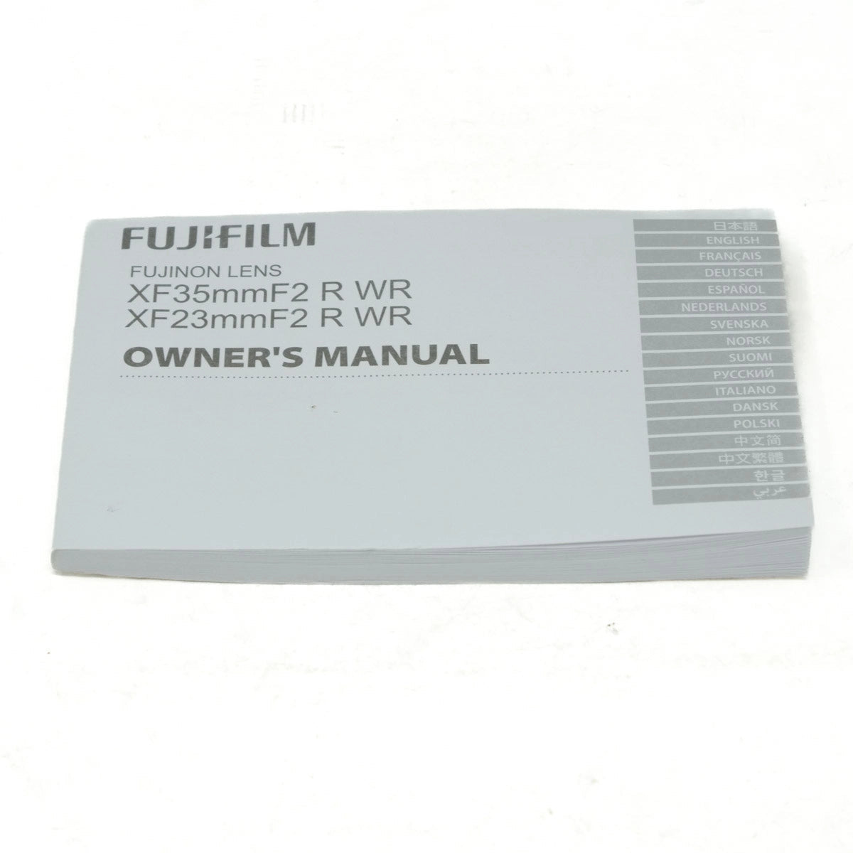 Owner's manual for Fujifilm camera lenses on a white background