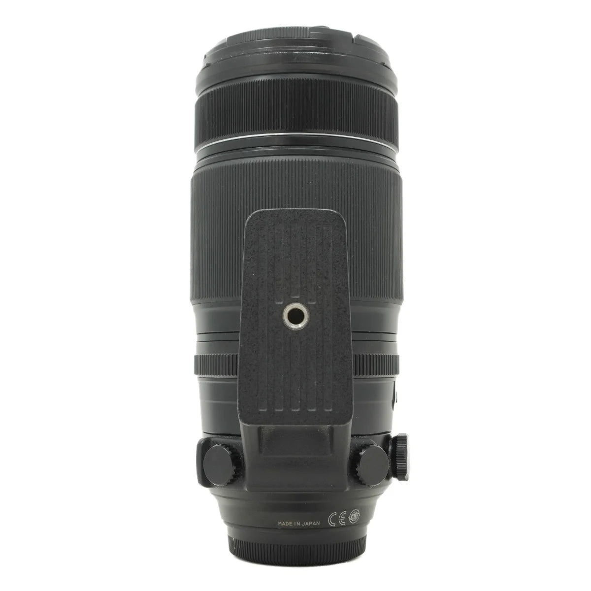 A black camera telephoto lens with a textured grip and central mounting plate, shown from the back against a plain white background.