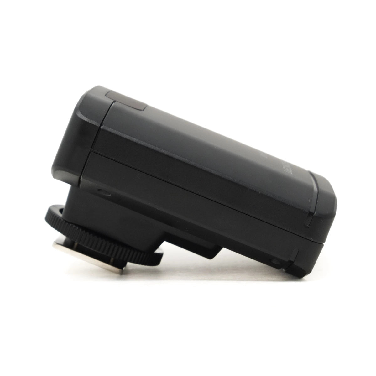 Black camera flash on a white background