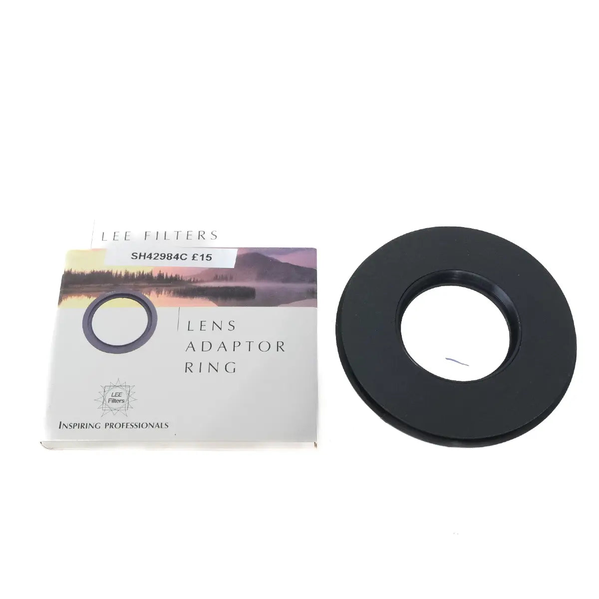 Lens adaptor ring with packaging on a white background
