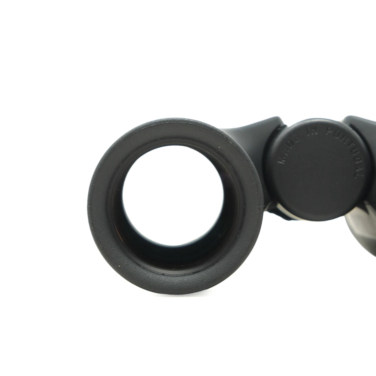 Close-up of a black binocular lens with a textured rubberized edge and a black adjustment knob, shown on a plain white background.