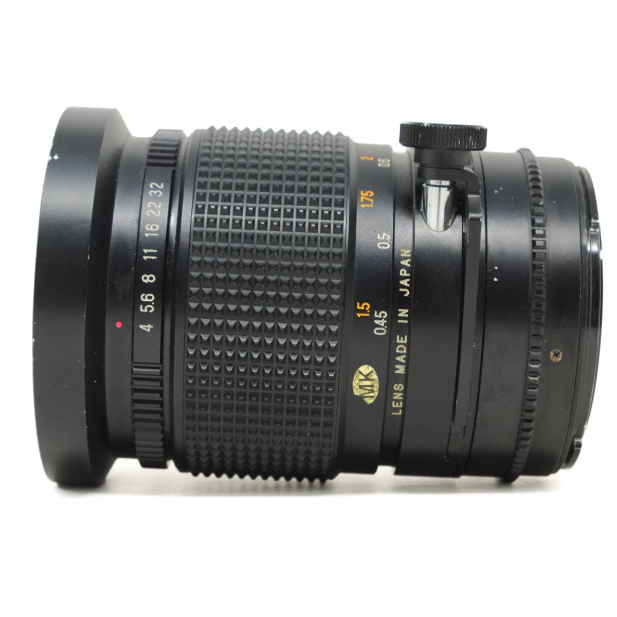 Camera lens with text 'Lens Made in Japan' on a white background