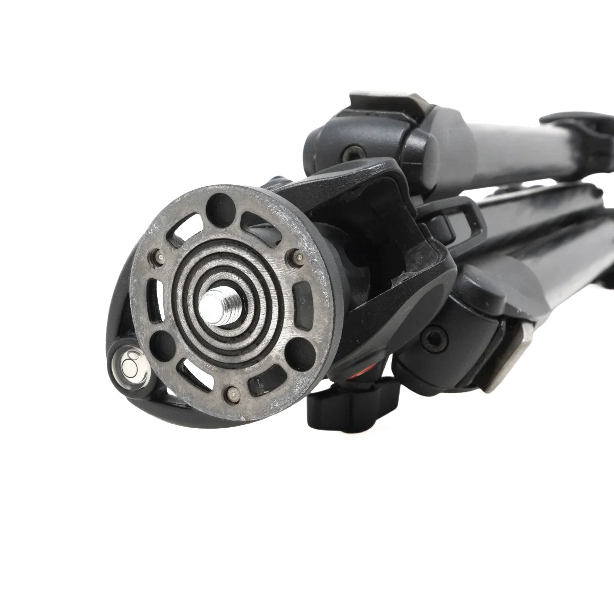 Close-up of a tripod leg with a round metal mounting plate and black adjustable leg sections on a white background.