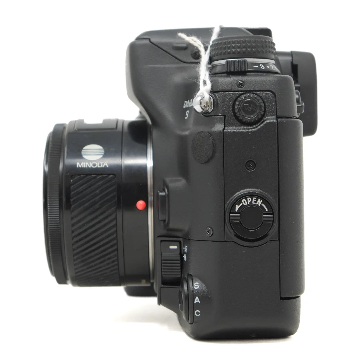 Used Minolta Dynax 9 Pro Film camera with 50mm F1.4 lens - side angle