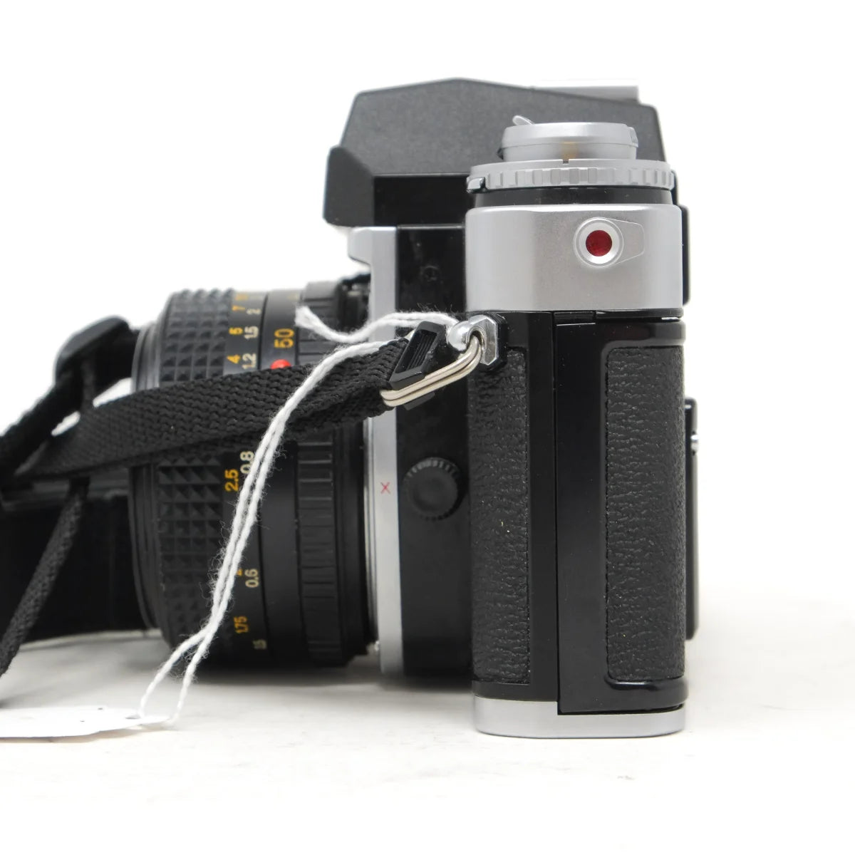Used Minolta XE-5 film camera with 50mm F2 - side angle