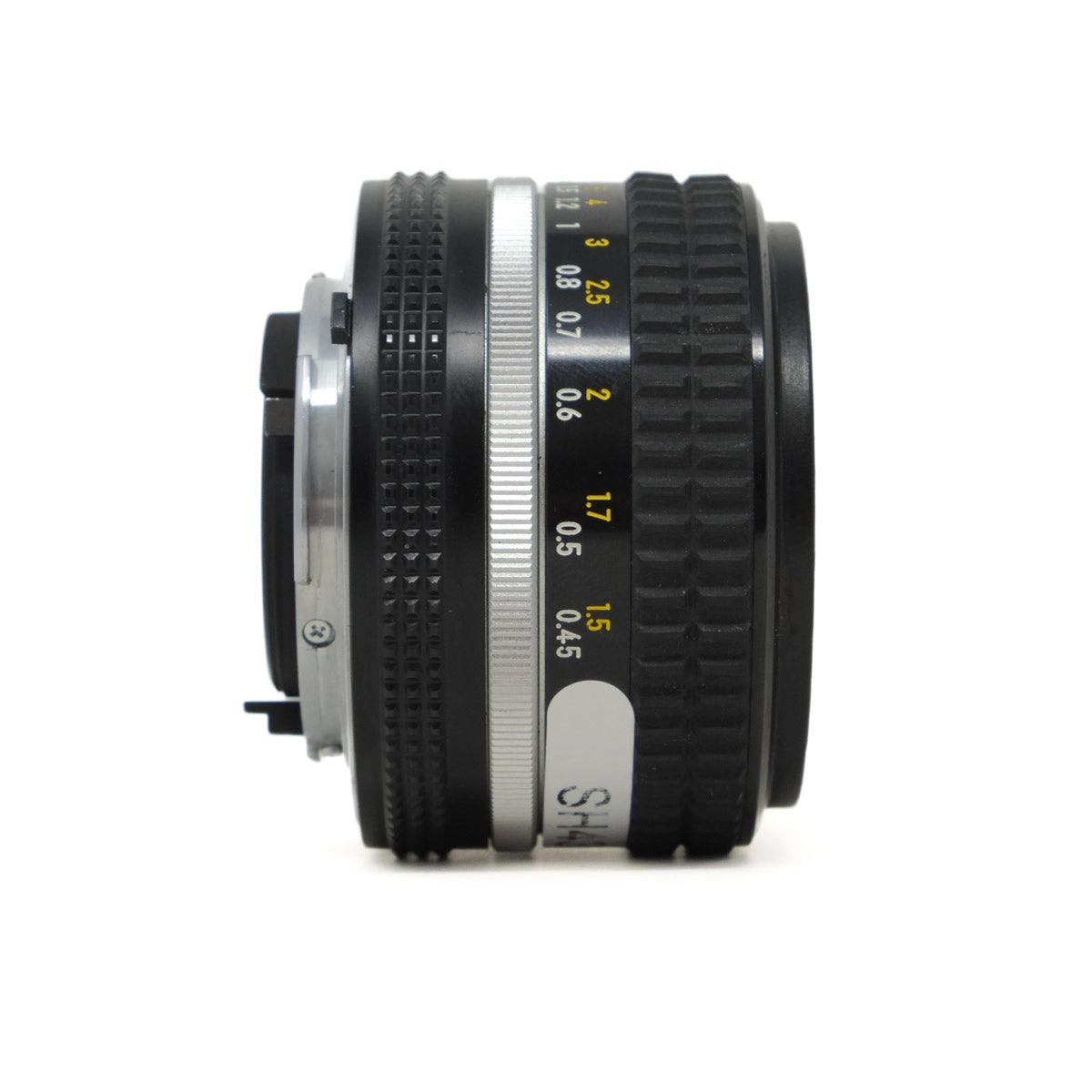 Camera lens with focus scale on a white background