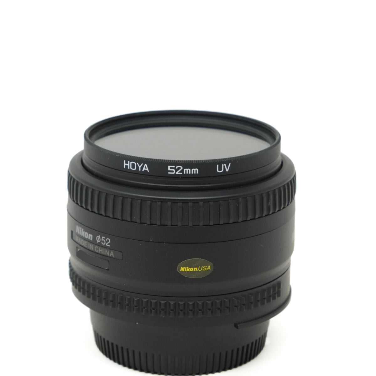 Camera lens with Hoya and Nikon branding on a white background