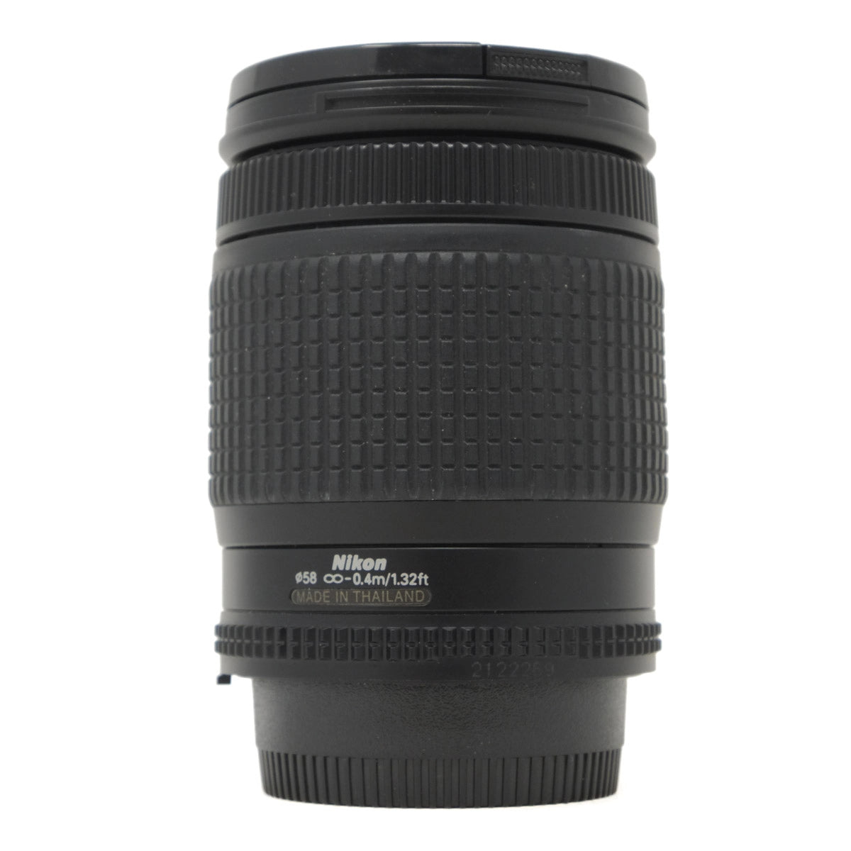 Black Nikon camera lens on a white background