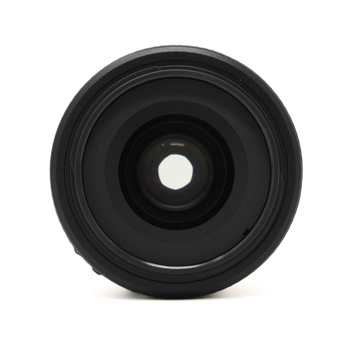 Black camera lens on a white background