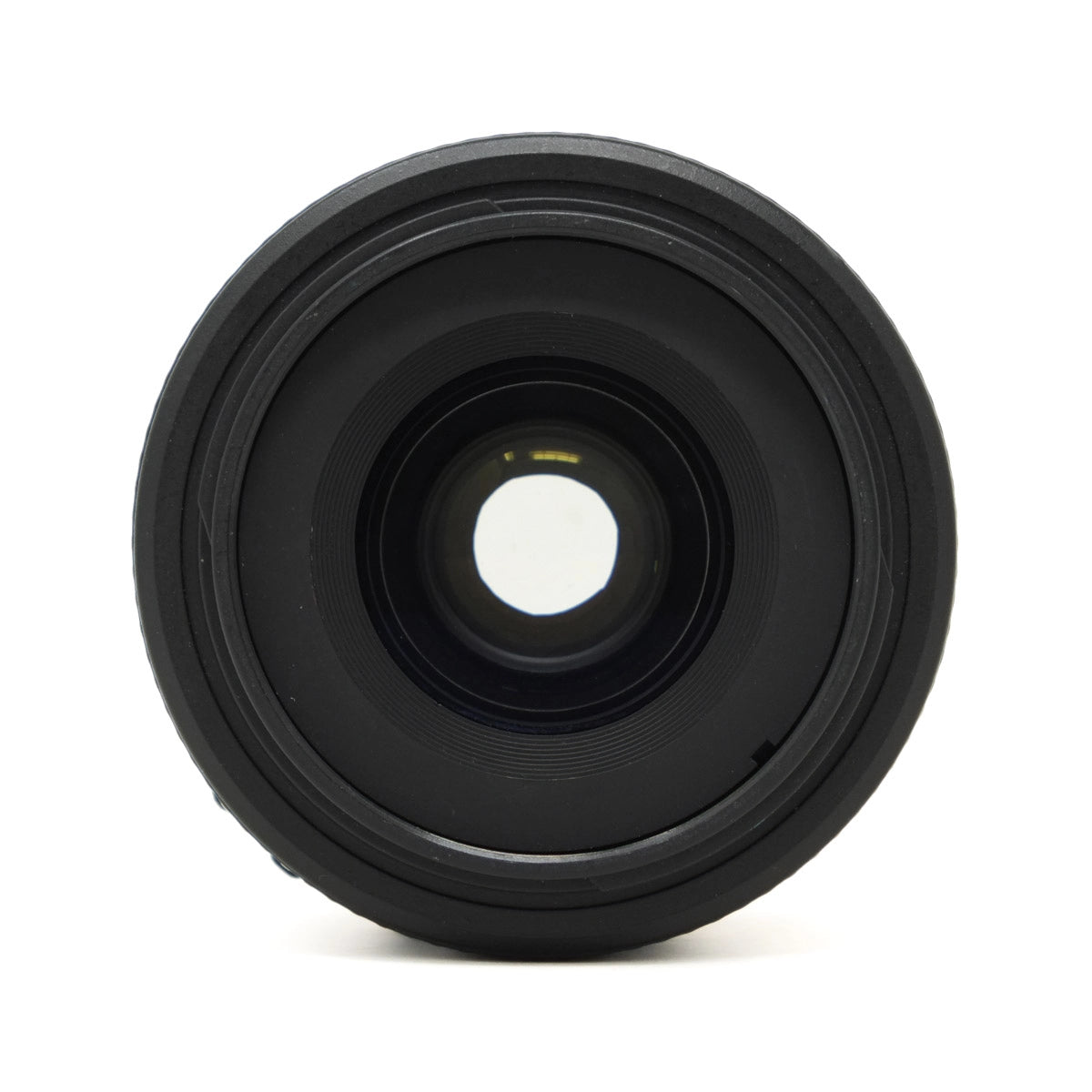 Black camera lens on a white background