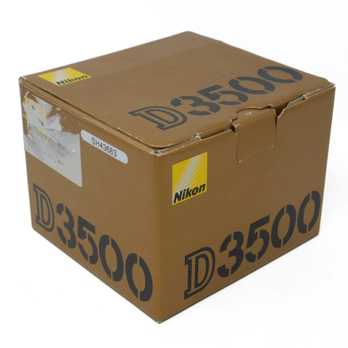 Brown cardboard box with 'Nikon D3500' branding on a white background