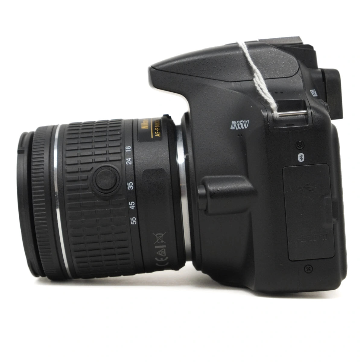 Black DSLR camera with lens on a white background