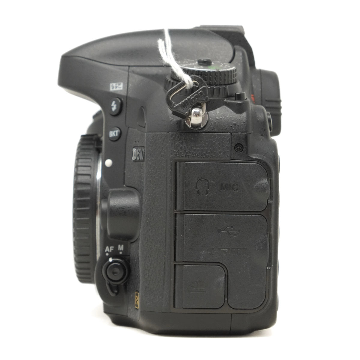 Side view of a black DSLR camera on a white background