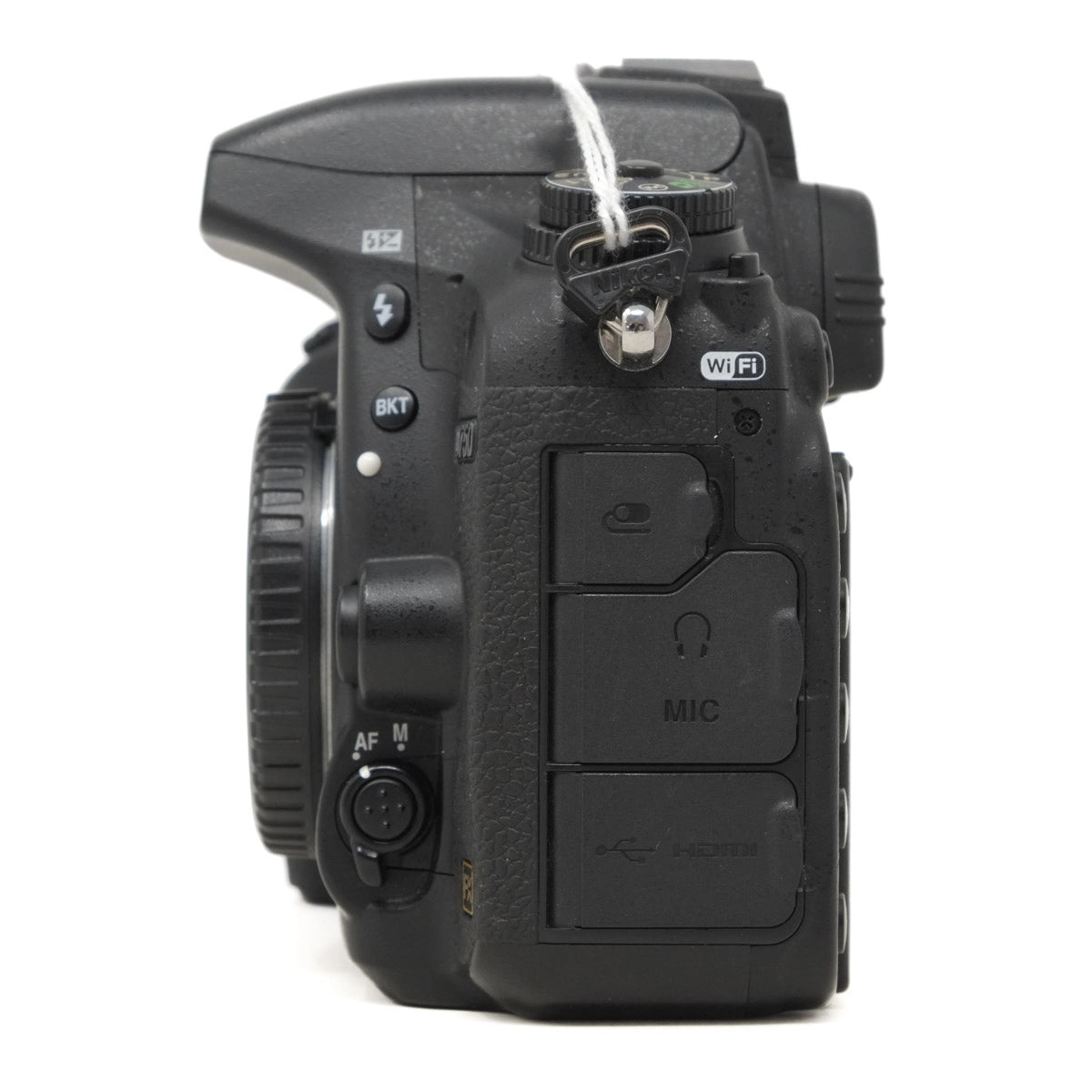 Black camera body with control buttons on a white background