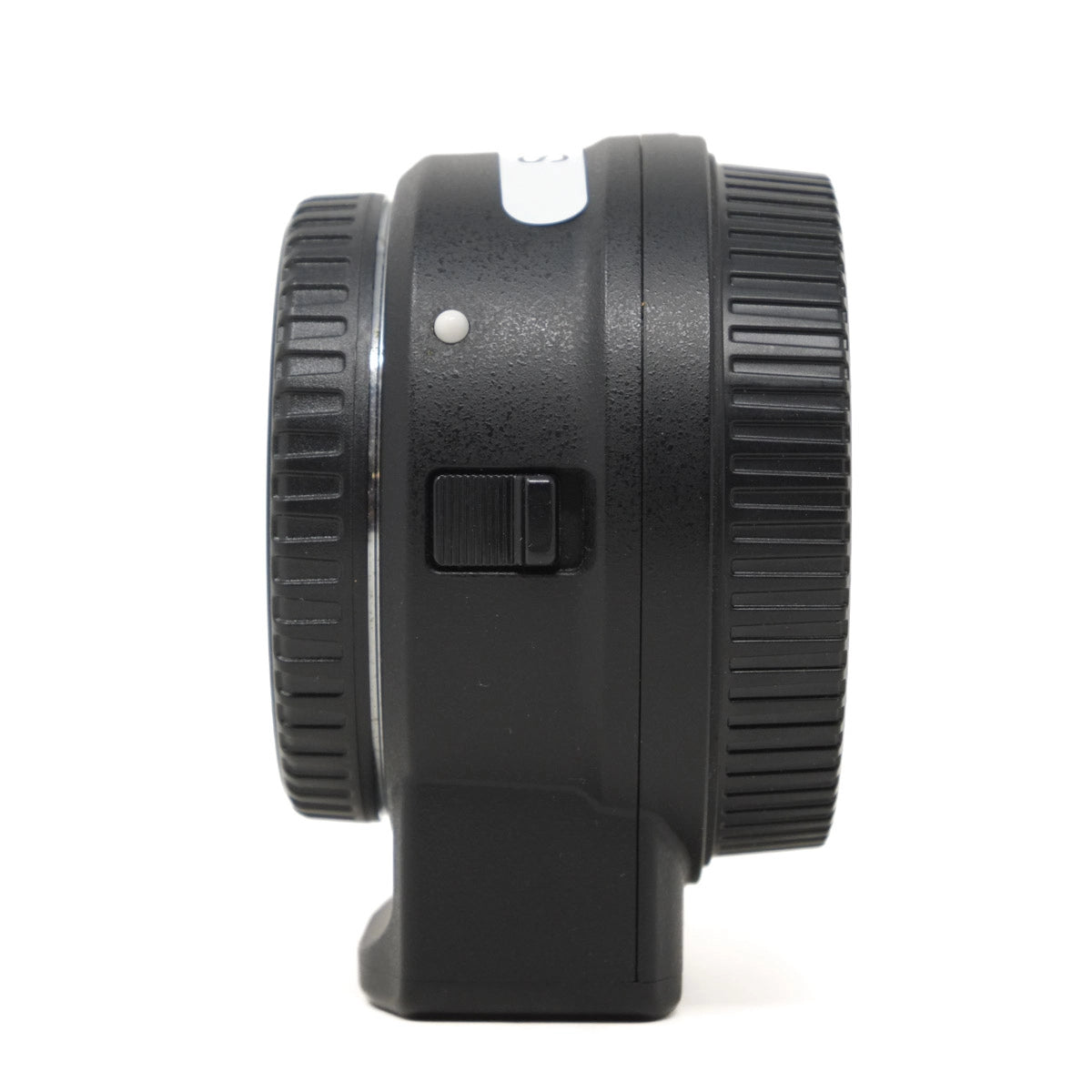 Black camera lens adapter on a white background