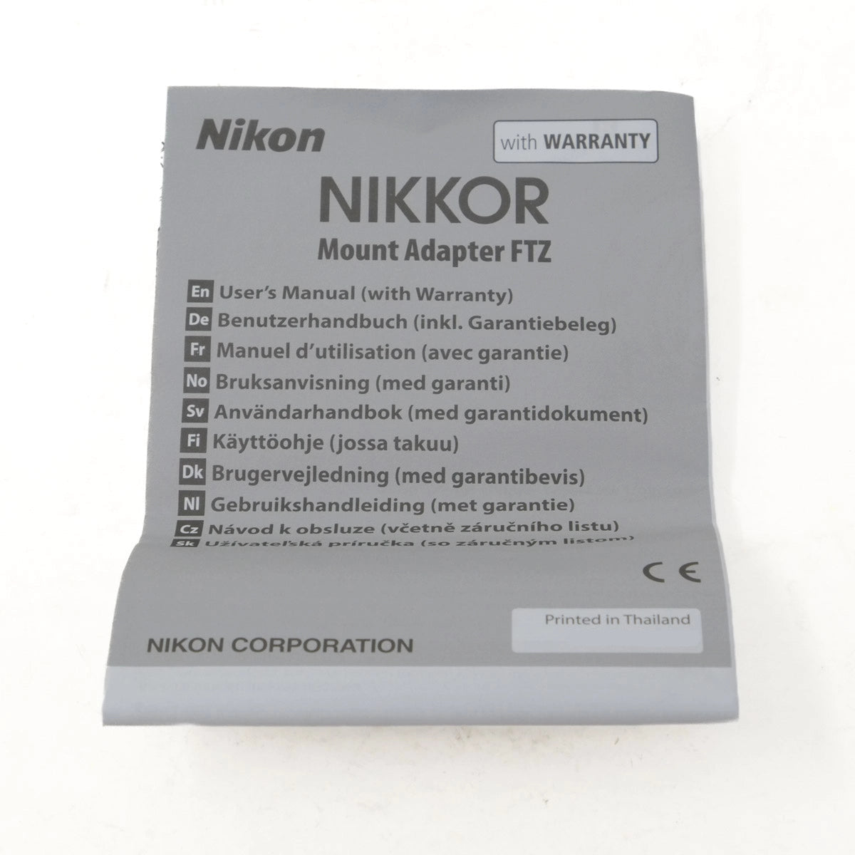 Nikon Nikkor Mount Adapter FTZ packaging with user manual on a white background