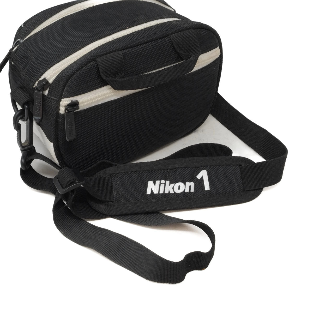 Black and white camera bag with Nikon logo on a white background