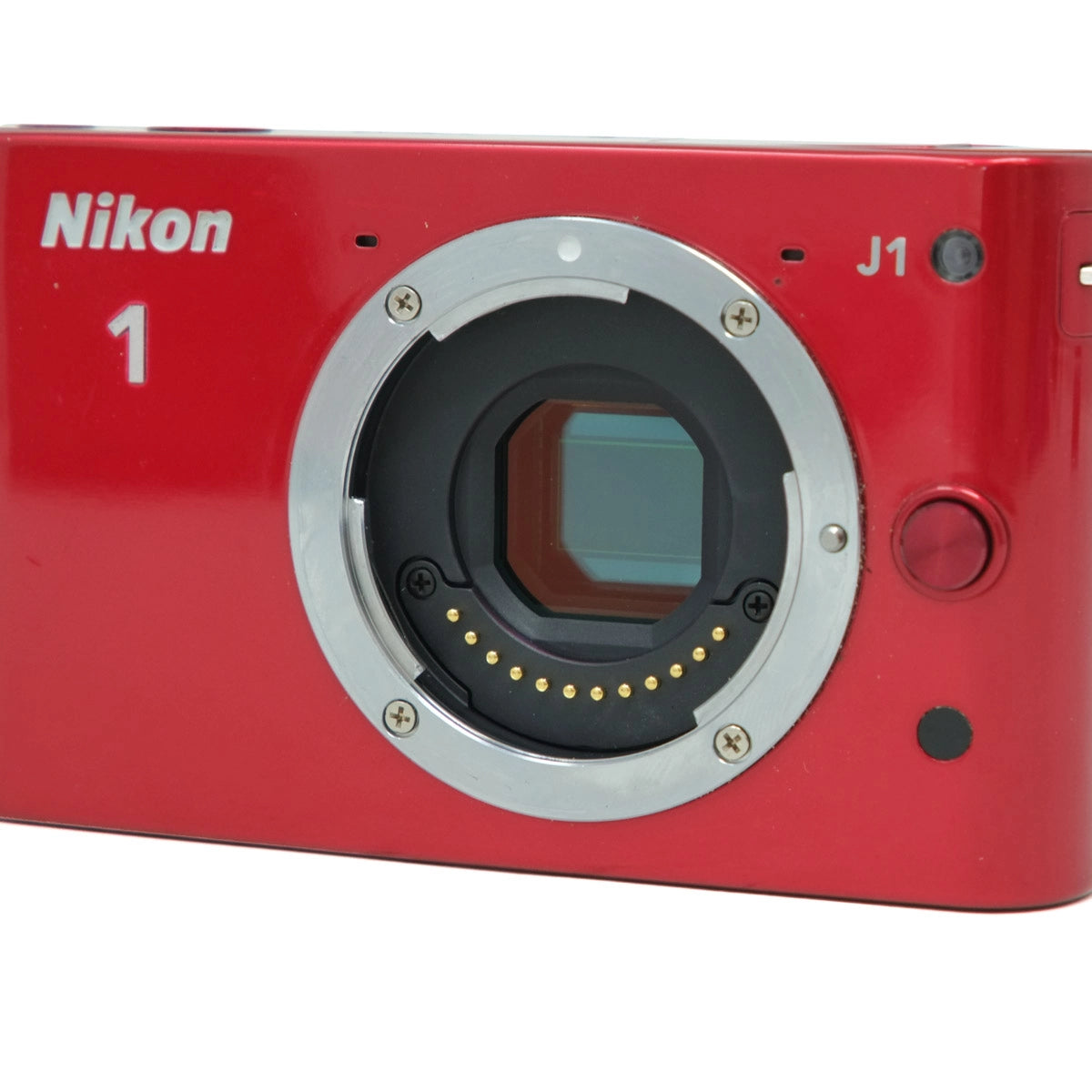 Red Nikon J1 camera body on a white background