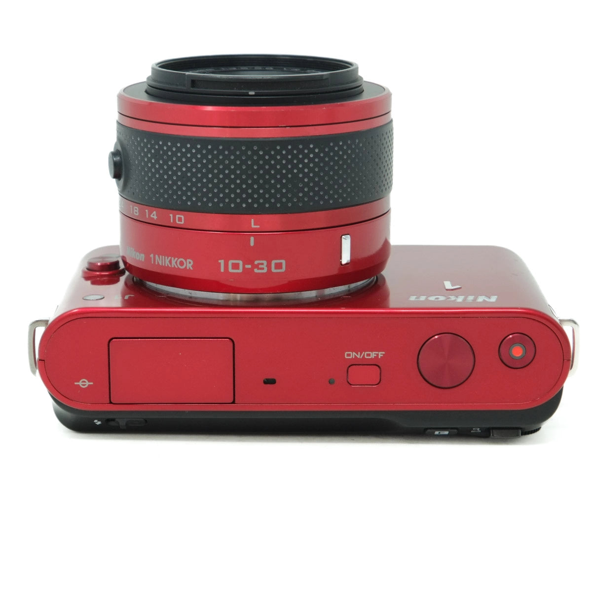 Red camera lens and housing on a white background