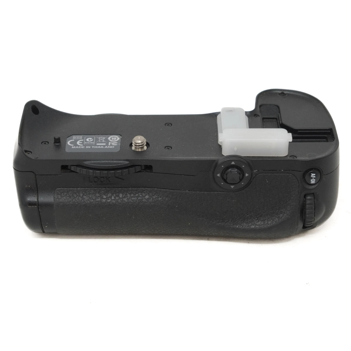 Black camera battery grip on a white background