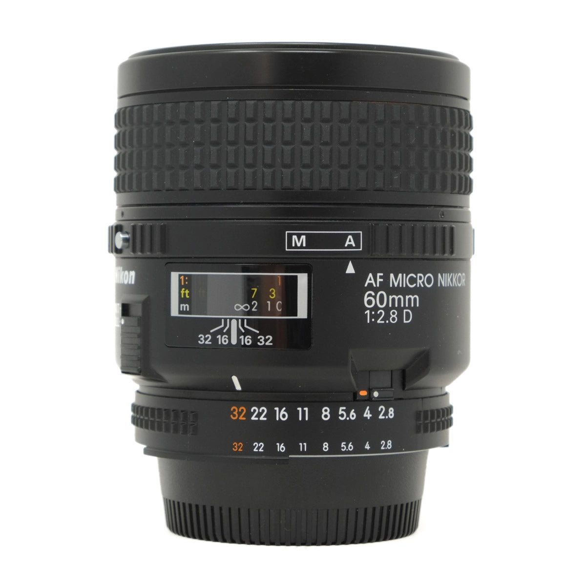 Black Nikon camera lens on a white background