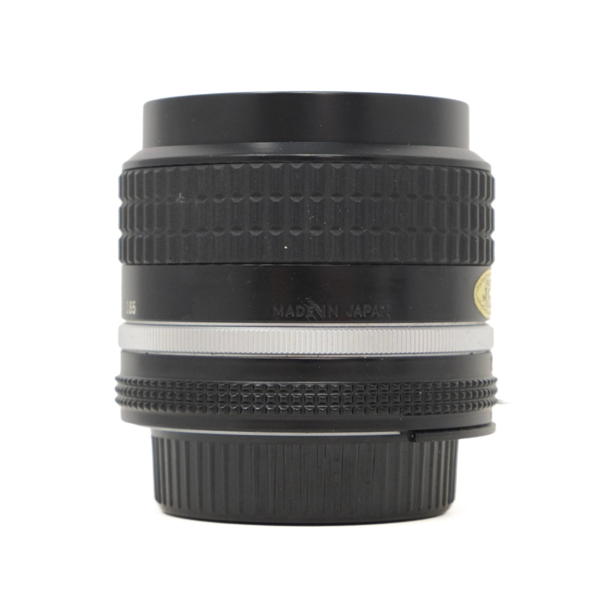 Camera lens with 'Made in Japan' text on a white background