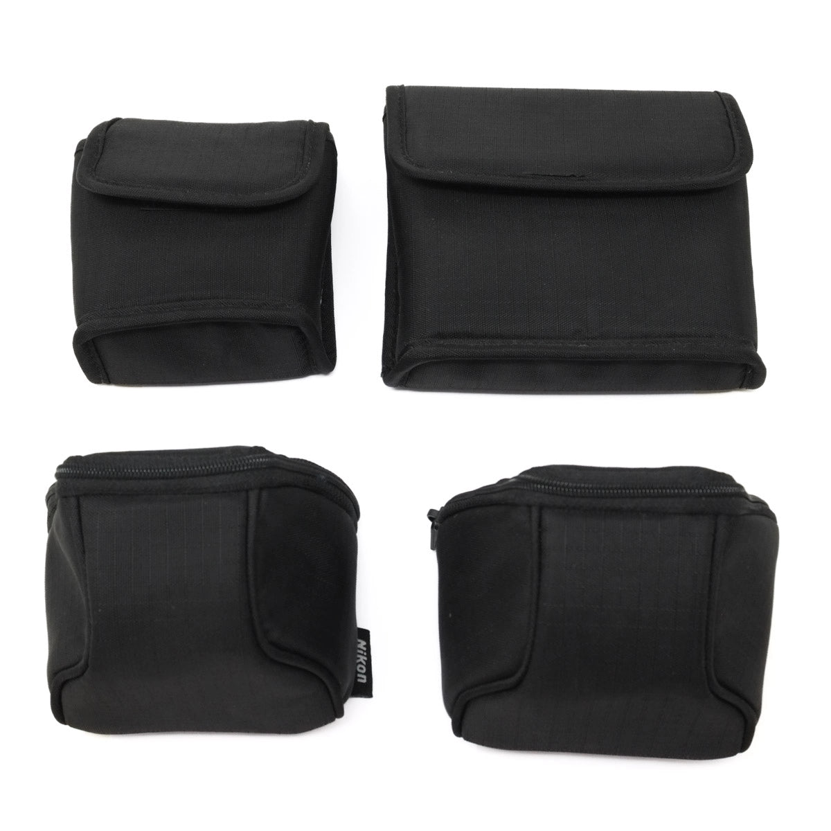 Four black cases arranged in a 2x2 grid on a white background