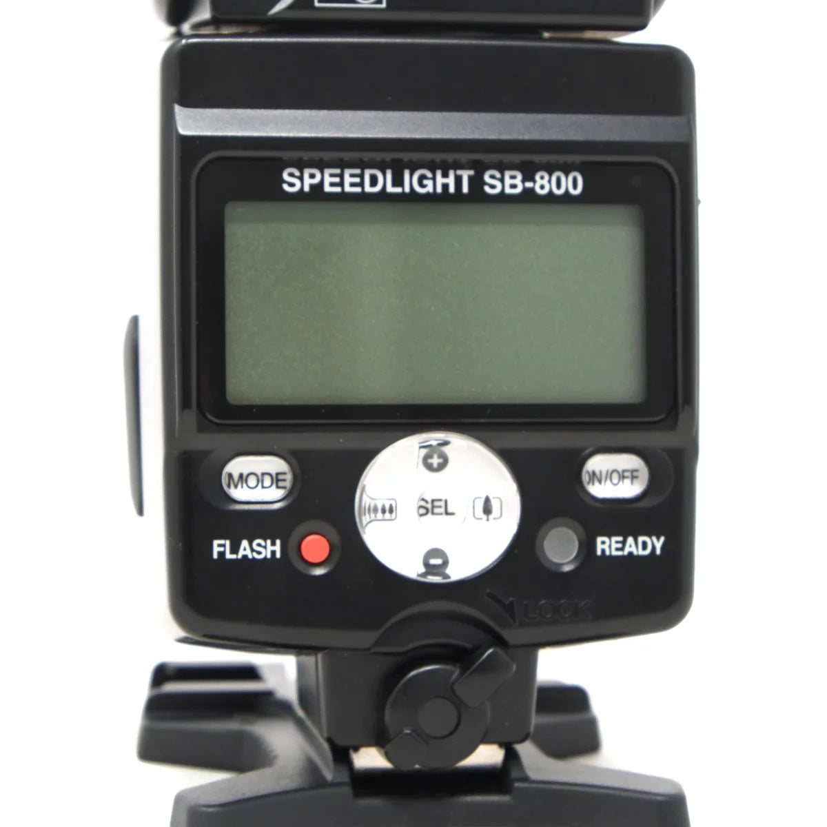 A close-up of a Speedlight SB-800 camera flash unit with its digital display screen on, showing the mode and ready buttons on a white background.