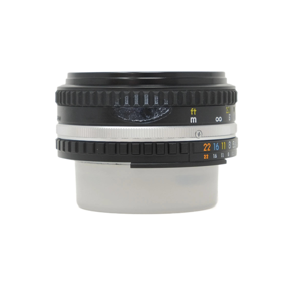 Camera lens with focus and aperture control on a white background