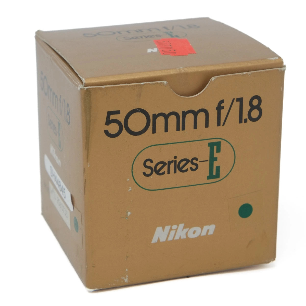 Cardboard box with Nikon camera lens specifications on a white background