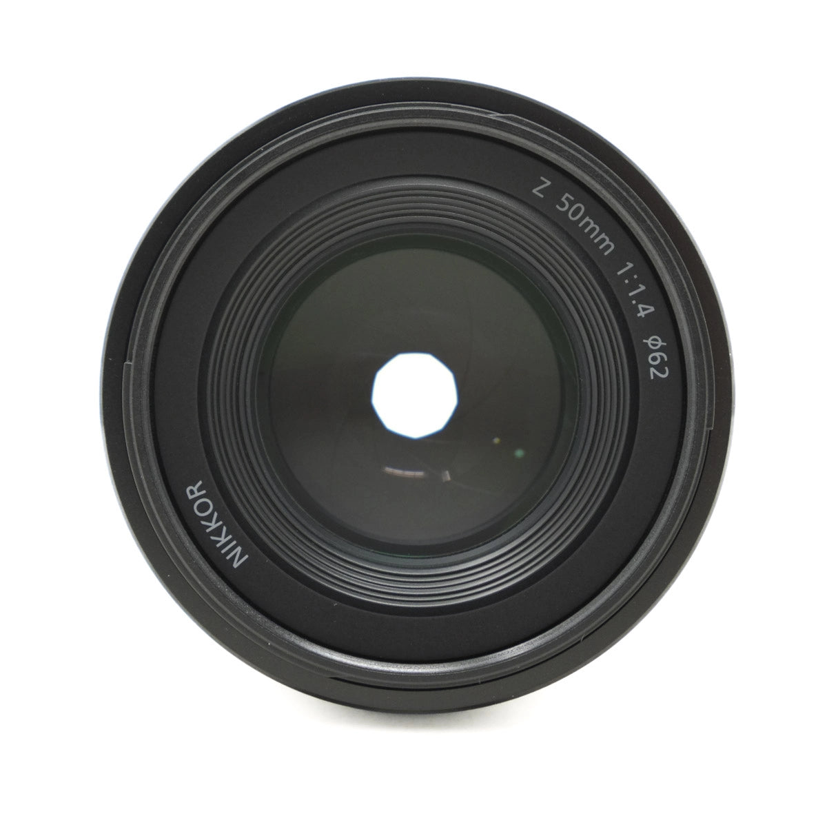 Camera lens with 'Nikon' branding on a white background