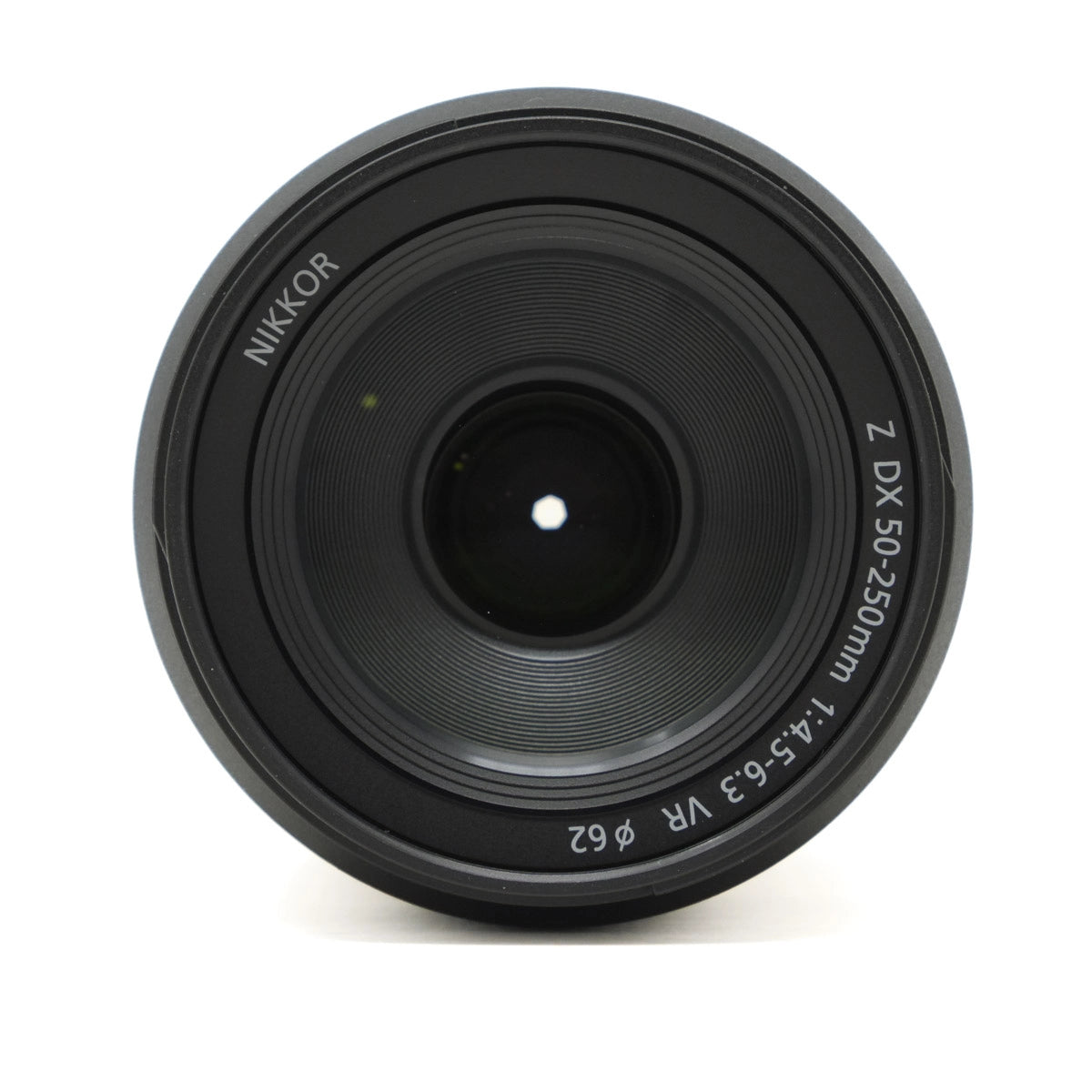 Black camera lens with 'Nikkor' branding on a white background