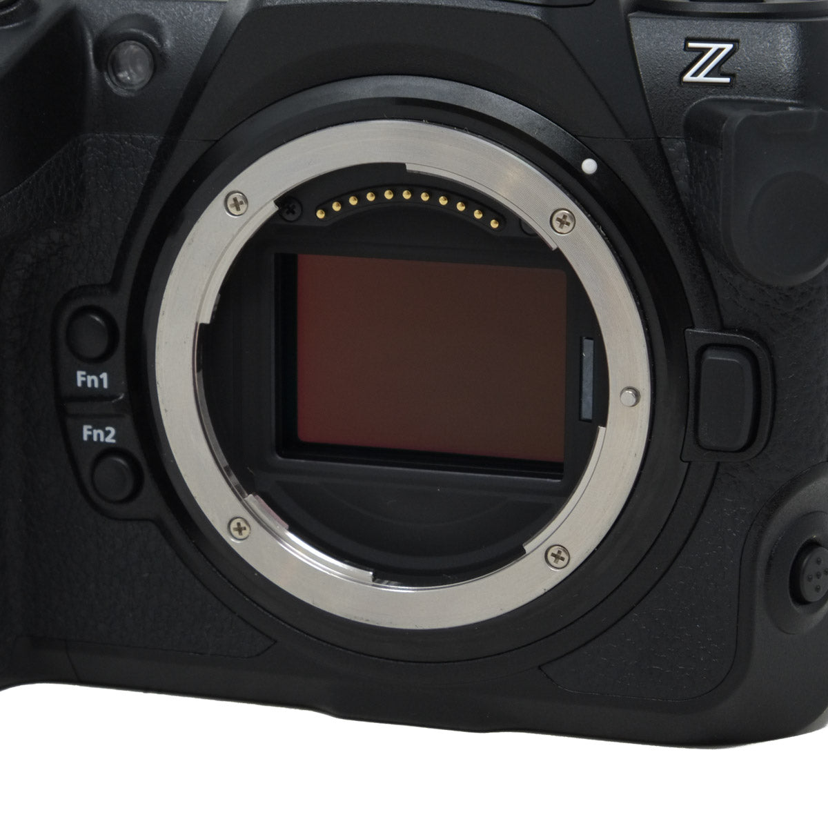 Close-up of a camera body with a lens mount on a white background