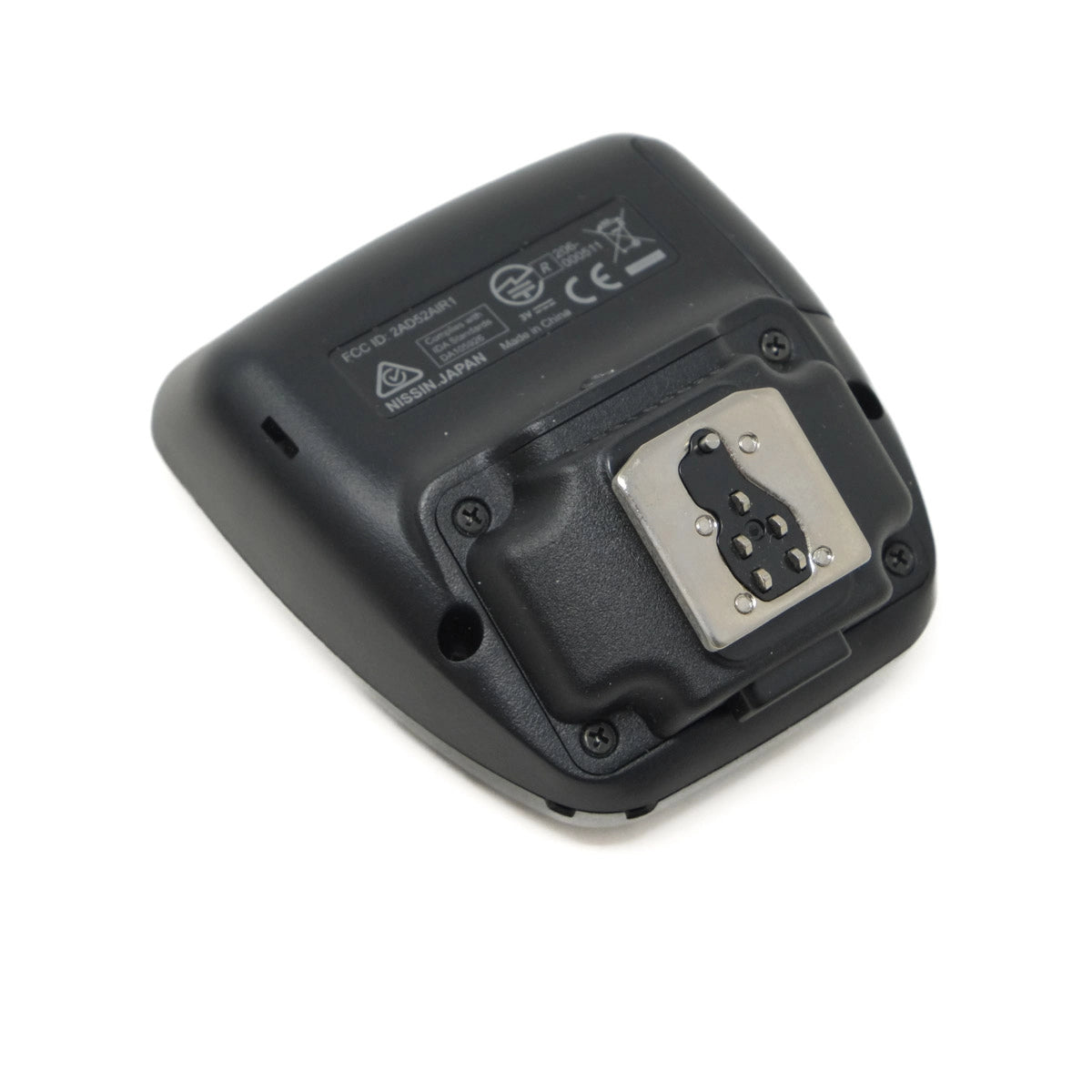 Black electronic device with a metallic connector on a white background